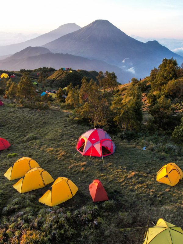 Aerial view of beauty mountain peaks Prau Dieng, Central Java and the climbers and tent. Wonosobo, Indonesia